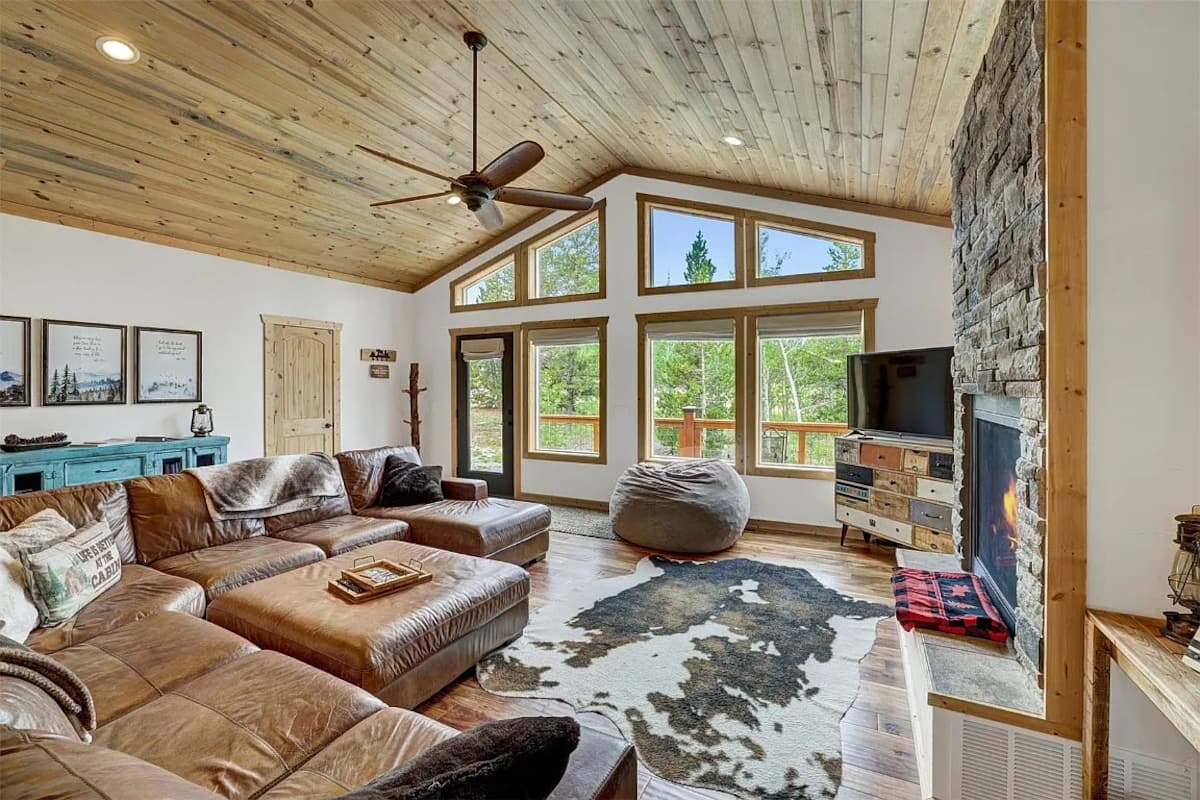 Living room with tall windows and fireplace