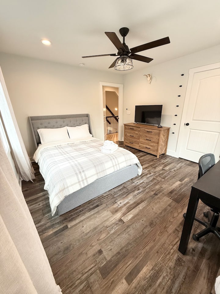 Queen bed. Dresser with storage. Full closet. Workspace. Smart TV.
