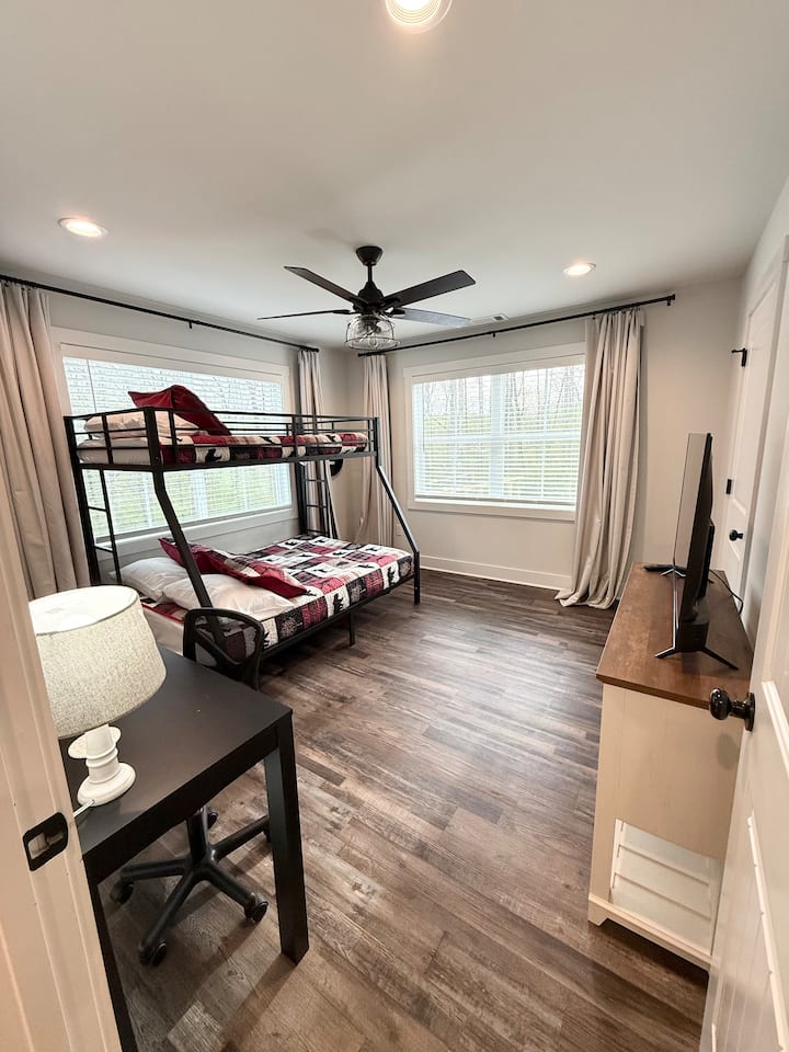 Bunk bed sleeps 3 kids comfortably.