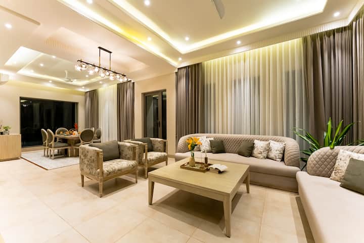 This is the living room located on the ground floor with an attached powder room.