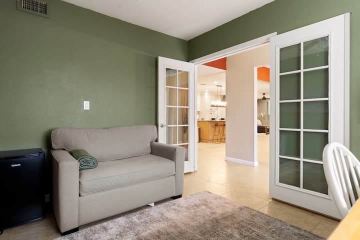 The versatile bedroom 4, perfect as a dedicated office or guest room! Featuring a stylish fold-out couch bed, it's the ideal blend of functionality and comfort.