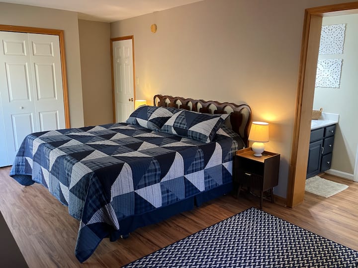 Master bedroom with ensuite bathroom located on main floor. King sized mattress. 