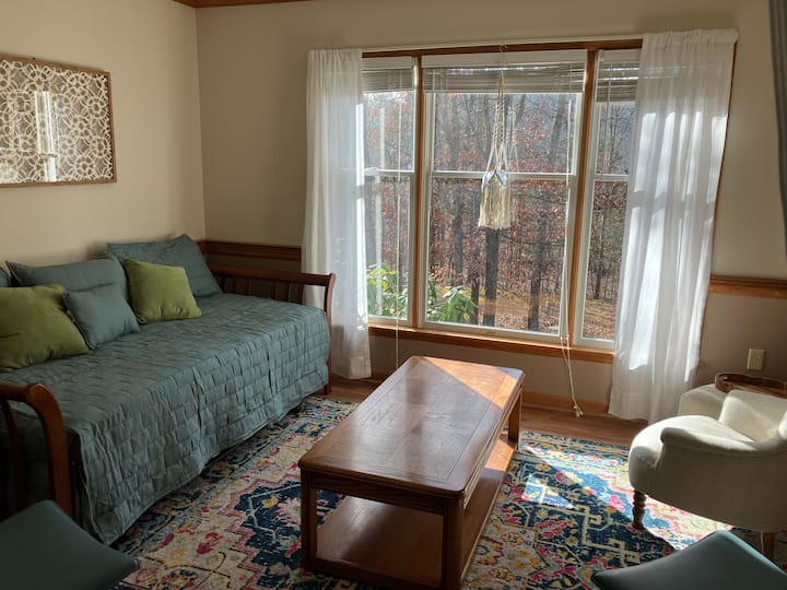 Sitting/Board game room off the kitchen also has a day bed with trundle underneath.  Curtains provide privacy to kitchen.  Located on main floor. 