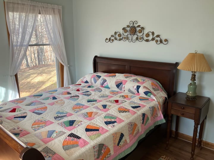 Queen bed with bathroom access right outside doorway.  Located on main floor.  