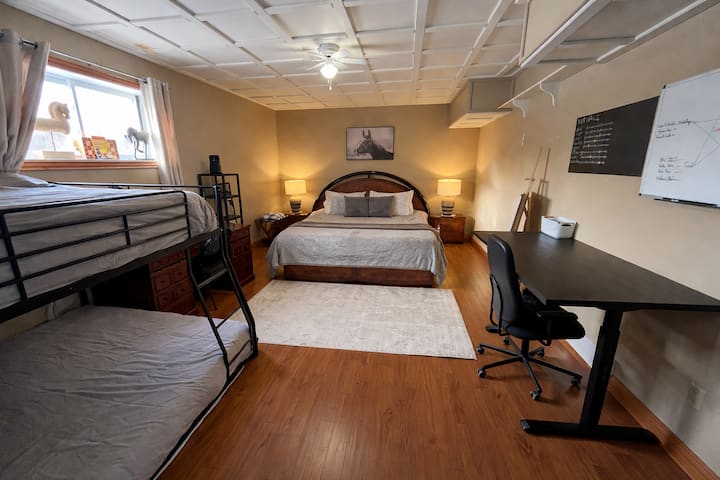 King Suite - Largest room — ideal for a family of four. King, queen, and a double bed.