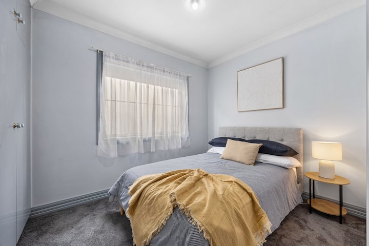 A comfortable second bedroom with a double bed, suited to couples or solo guests.