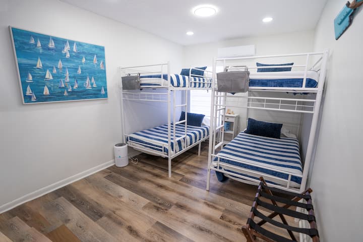 The second bedroom includes 2 bunkbeds.