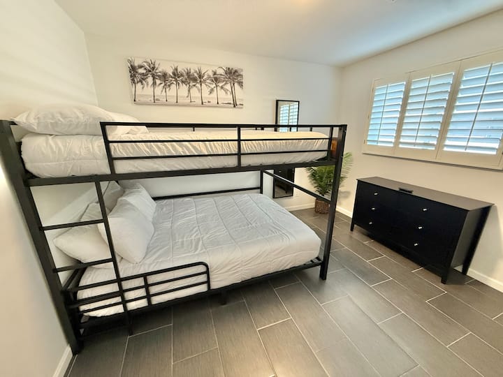 Bedroom 2- Queen bunk beds, 6-drawer dresser, 55" Smart TV, Full-length mirror, closet, luggage rack