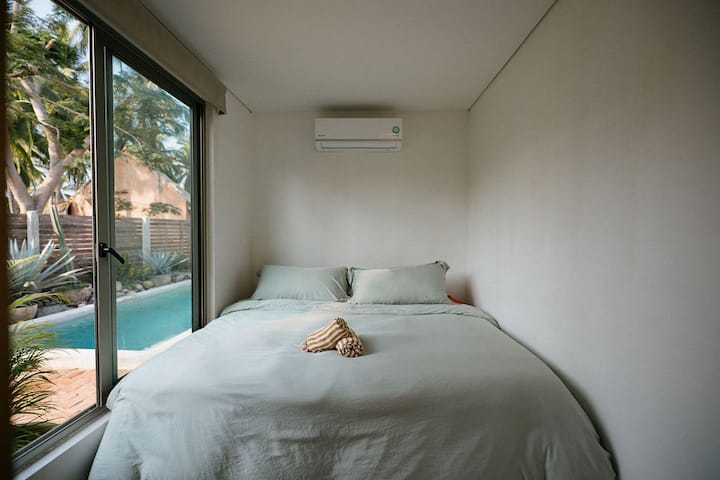 Pool view and king size bed from Casita Luna