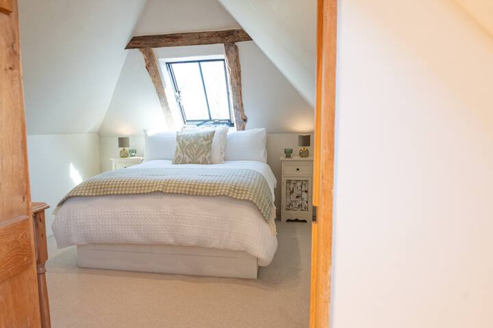 Cosy second bedroom tucked beneath characterful beams