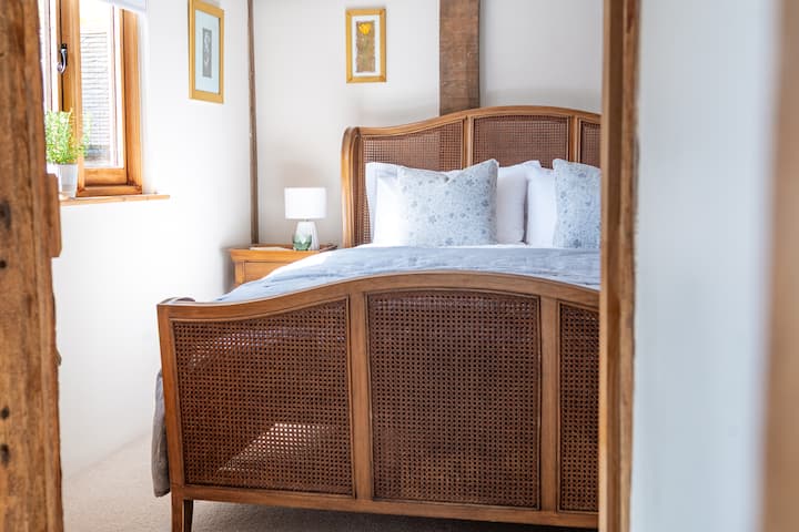 Beautifully styled king-size bed for a restful night’s sleep