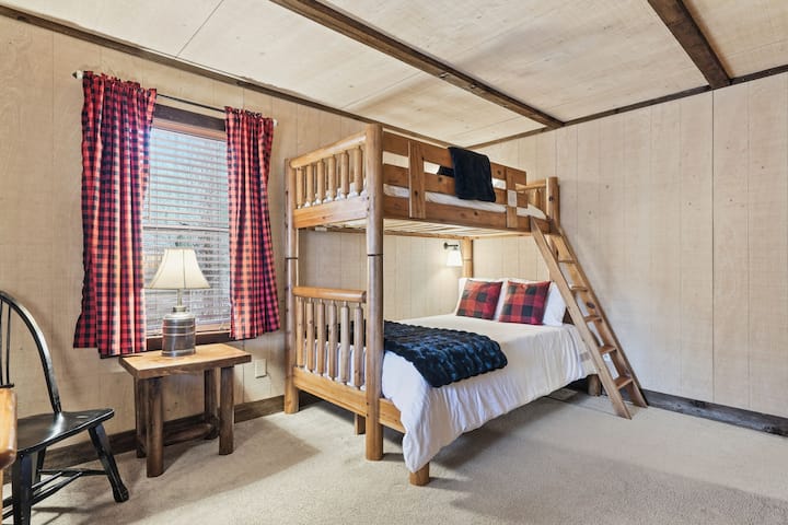 Comfortable twin over full bunk bed with plenty of storage and HD TV for your Bluey-loving crew!
