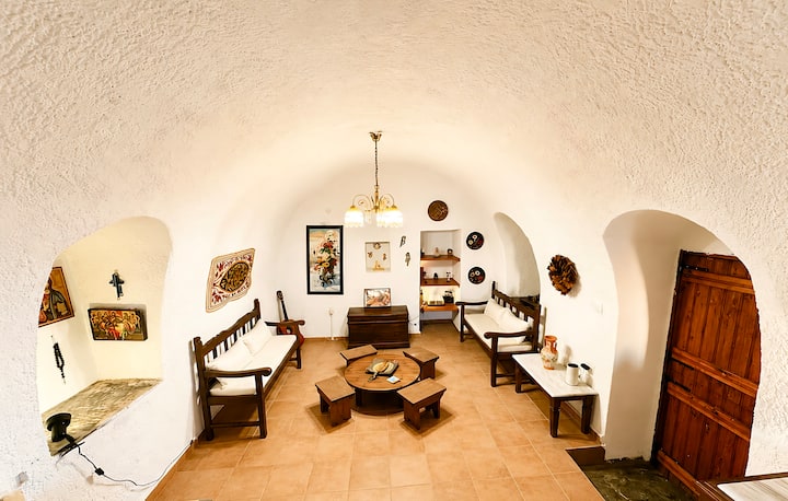 Living room beneath stone arches