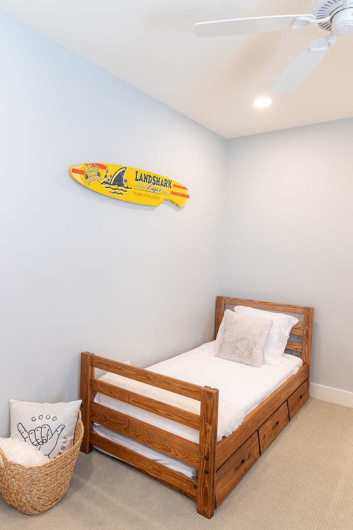 Fun, surf vibes for the twin trundle room.