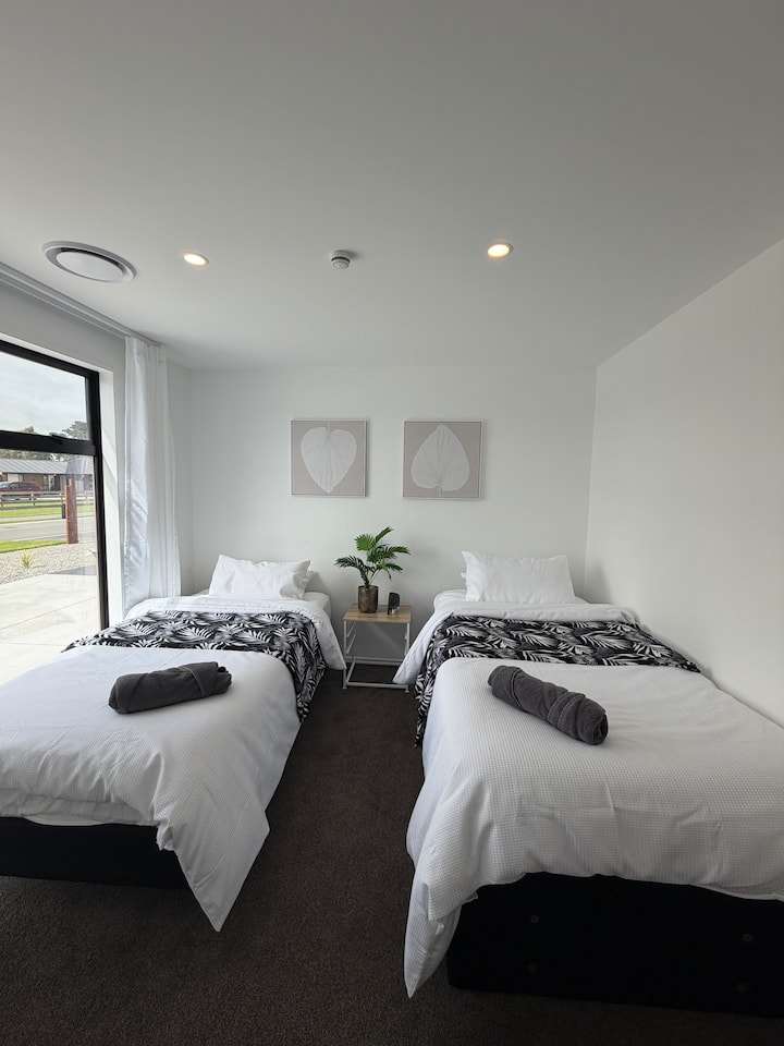2 king single beds. 1 trundler bed for an extra bed if needed. Can be put in another room or in the lounge.