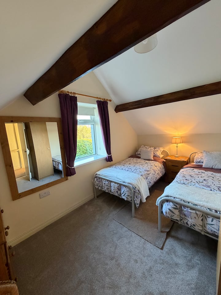 Bedroom with two single beds.