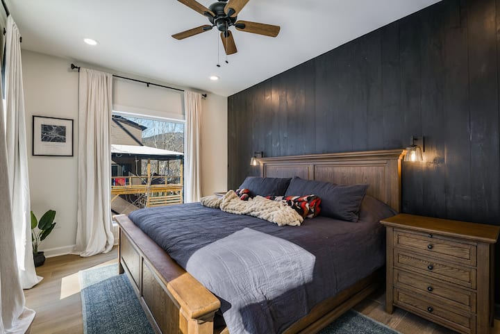 Bright and airy with beautiful natural light, this bedroom offers a peaceful place to unwind after a full day.