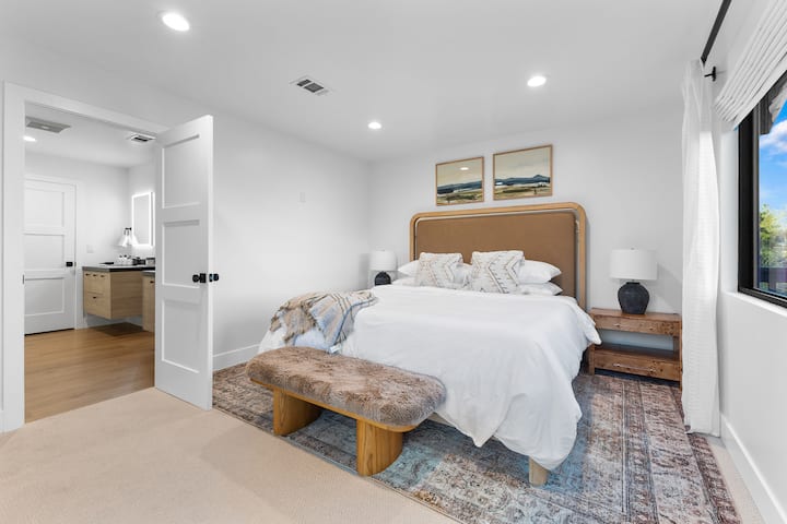 Master bedroom includes a king-size bed with high-thread-count linens and a private en-suite master bath.