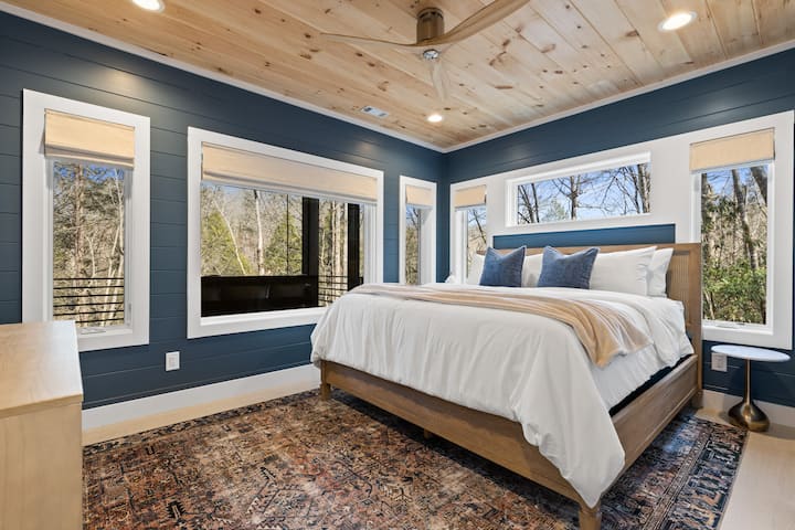 Welcome to the Whispering Creek Suite: This lower-level king room is attached to a shared bathroom and features creek-facing views. 
