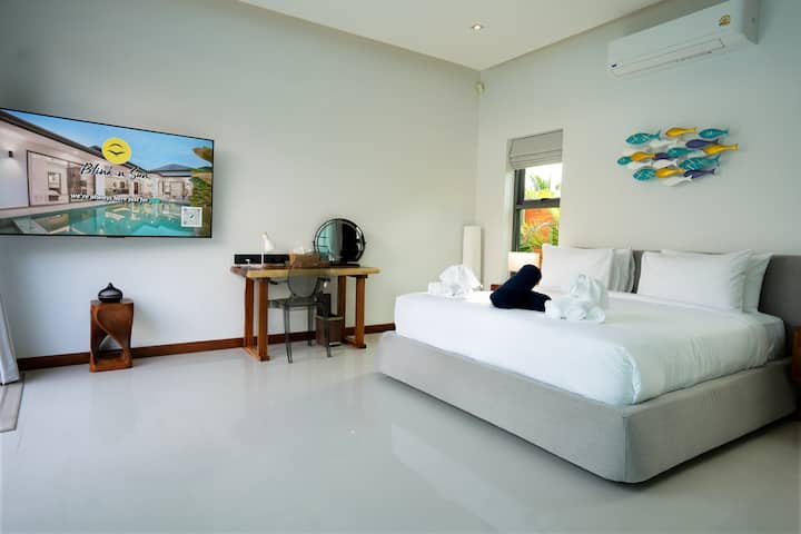 this bedroom has a separate bathroom . 