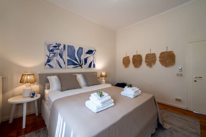 Double bedroom 1 of the apartment with a double bed, air conditioning and a wardrobe. Part of the unit with a bathroom, kitchen, and living room shared with the second bedroom.