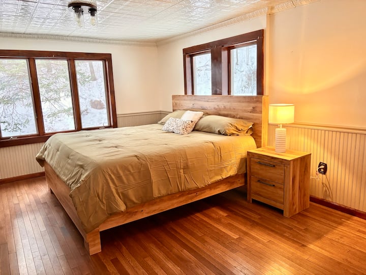 King-size bed and TV on the first floor with office. (Note--we will be adding black out curtains.)