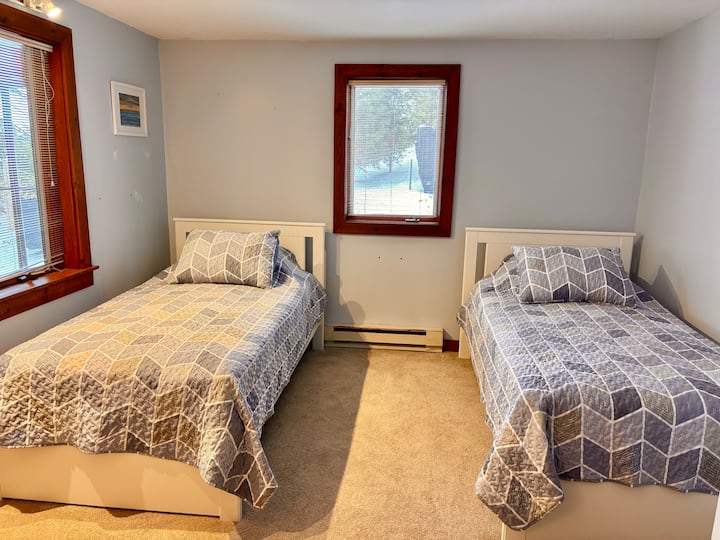 Two twin beds on the first floor. This room has an empty dresser for your clothes. 