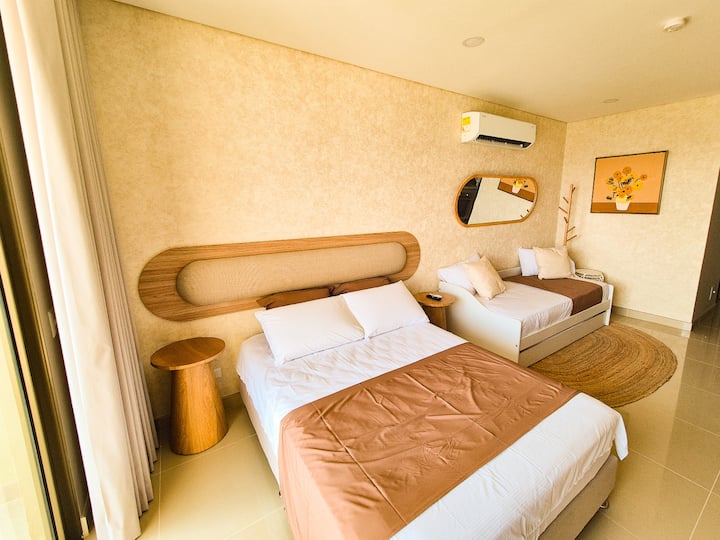 Comfortable and well-designed room with a double bed and a comfortable mattress. Organic design nightstands, 50" TV in front of the bed, blackout curtains to rest without light and ample storage space with a tall cabinet and dresser.