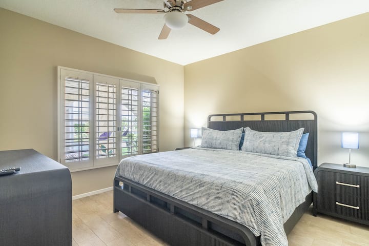 The secondary guest bedroom includes a king size bed and attached bathroom.