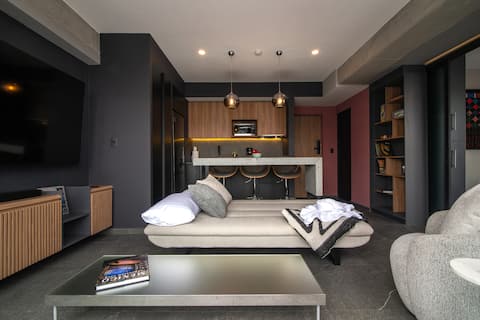 Successful Airbnb property: Stylish Modern Loft | Rooftop/Gym | Landmark View in Tabacalera