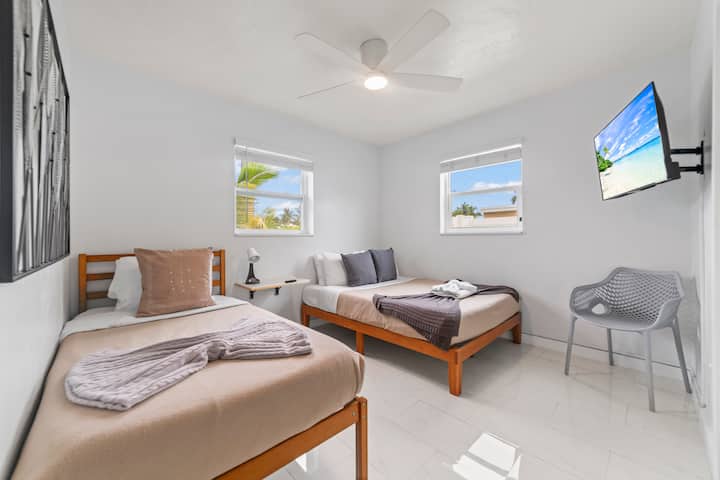Bedroom three flexes: a full bed plus a twin and its own TV. Kids, teens, or the odd guest out, everyone gets a real bed.