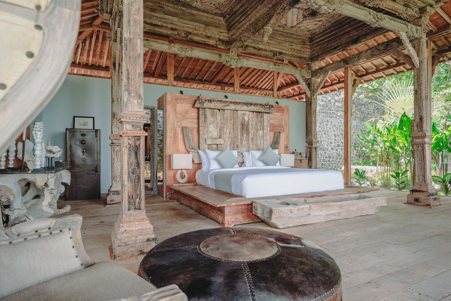Joglo suite with carved headboard