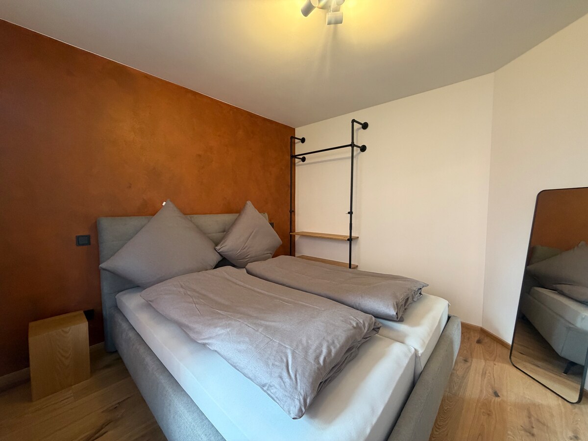 Quiet apartment with designer interior, garden and underground garage