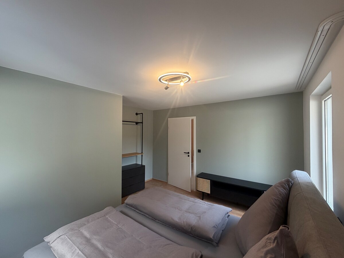 Quiet apartment with designer interior, garden and underground garage