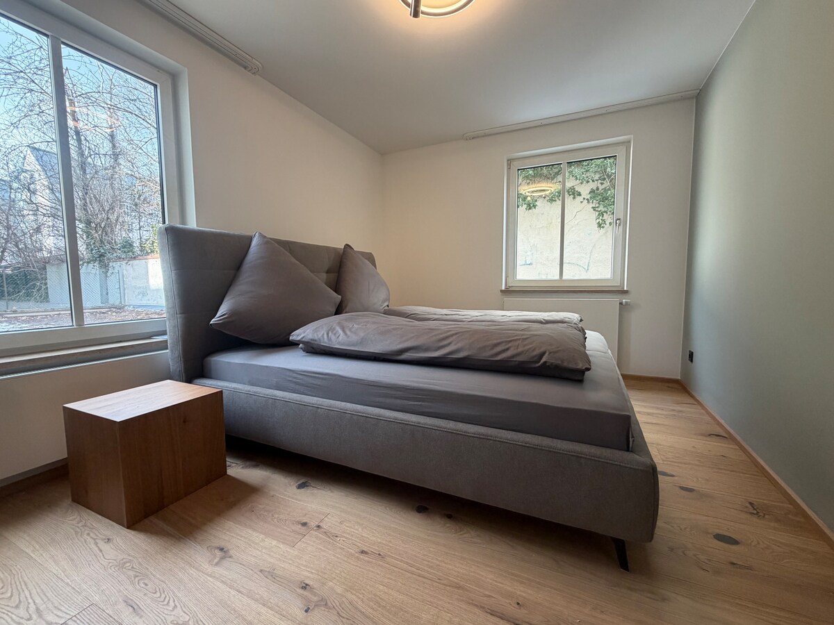 Quiet apartment with designer interior, garden and underground garage