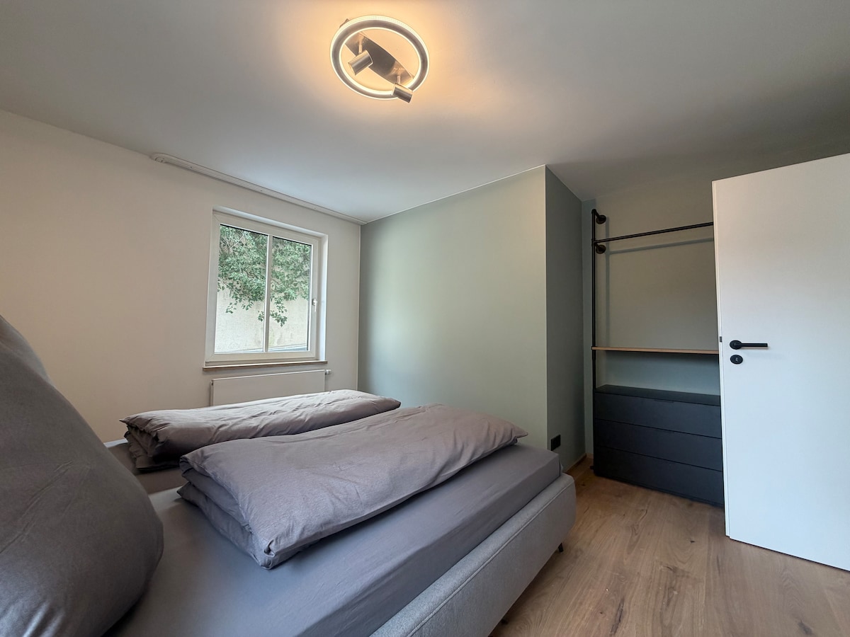 Quiet apartment with designer interior, garden and underground garage