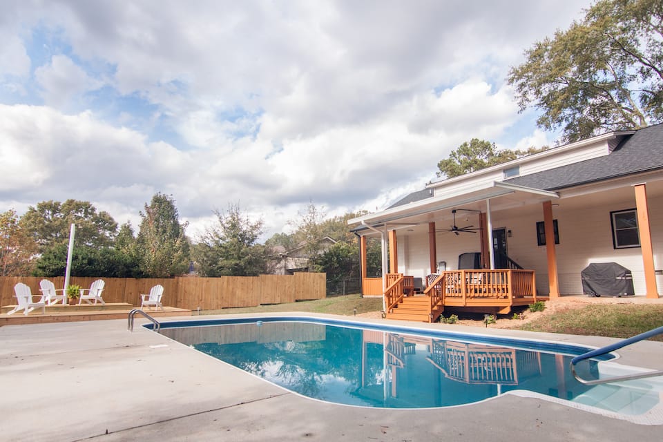 Pool with the covered patio and fenced yard