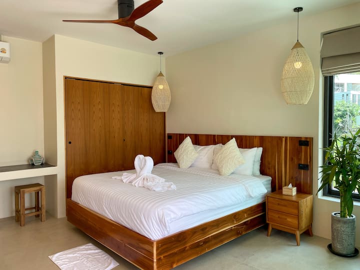 Bedroom with natural teak wood details