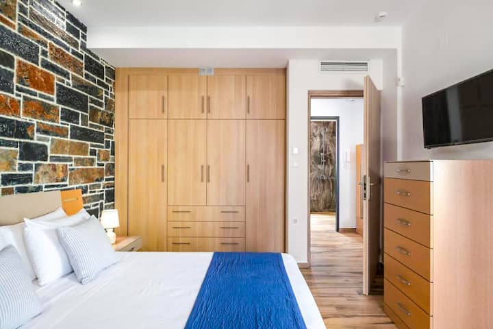 Upper Level - Bedroom 1 with queen bed and balcony access