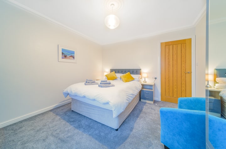 Generously sized front facing double bedroom with wardrobe and chest of drawers. There's enough space to place the travel cot in the room with you.