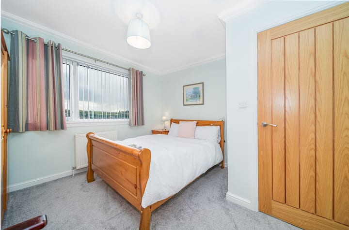 The second main bedroom also features a double bed, blackout blinds and a view out the back over the croft. You'll also have a comfortable chair, wardrobe, chest of drawers and a dressing table.