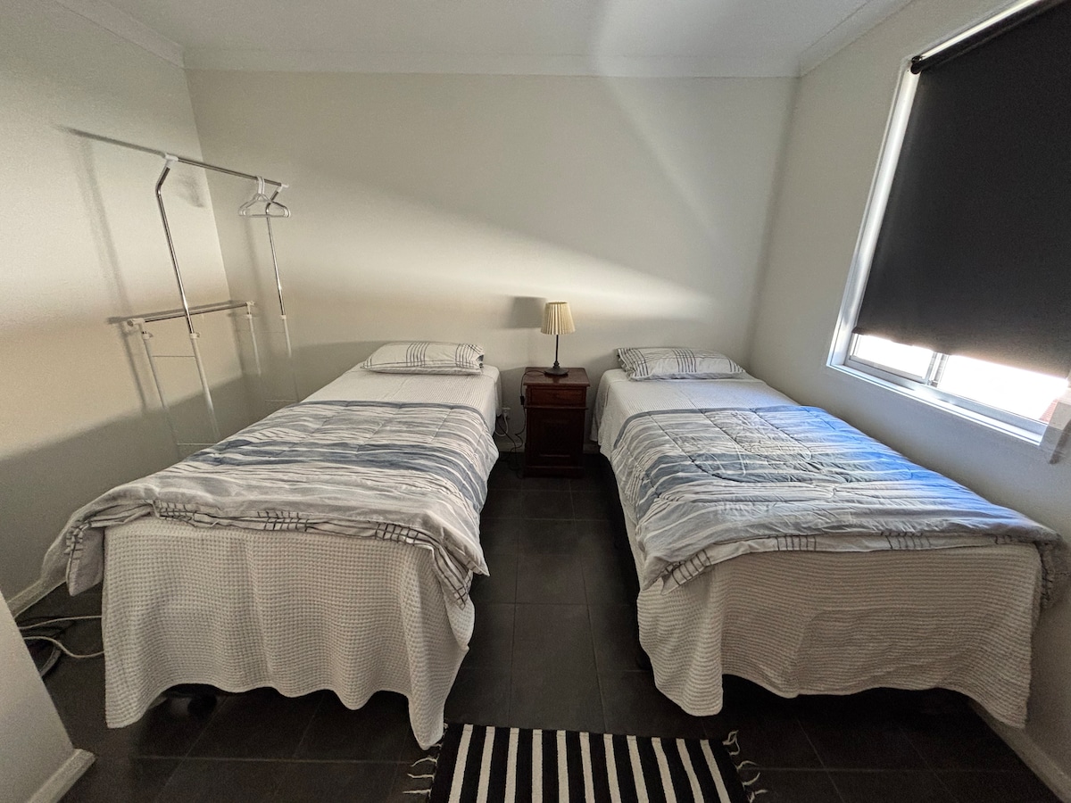 Two single beds with a pull out trundle third single bef