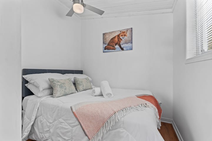 Cozy bedroom with soft linens, warm accents, and a peaceful atmosphere for a restful night.