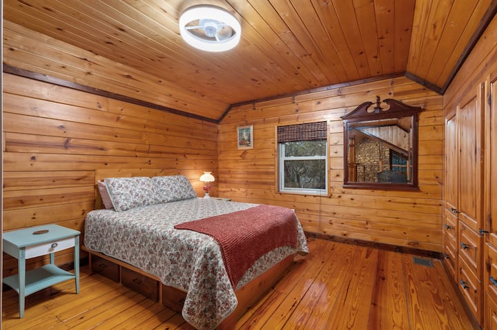 Upstairs Queen bed in loft with attached bathroom. Plenty of storage and closet space.