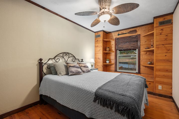 Downstairs bedroom with queen bed. Small room with some storage. Room is across from the half bath / utility room / laundry area and shares a wall with the master bedroom. 
