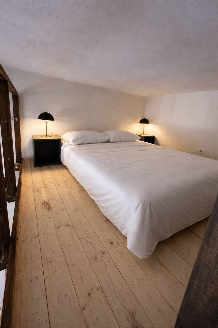 This room has a separate entrance from the pool area, and the bed is located in the loft, above the bathroom.