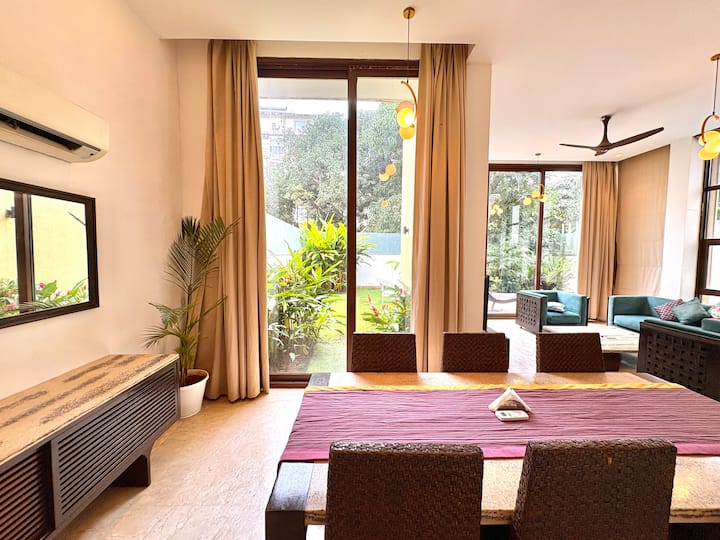 Elegant, sunlit dining room offering ample space for entertaining and shared moments.