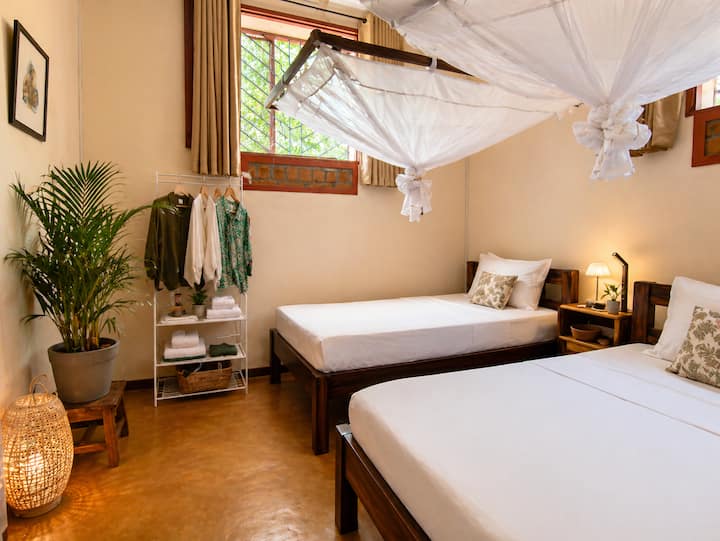 A bright room, designed for comfort and simplicity.