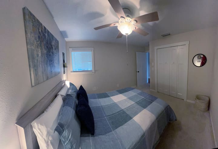 Bedroom 3 features a queen bed, closet and two nightstands.