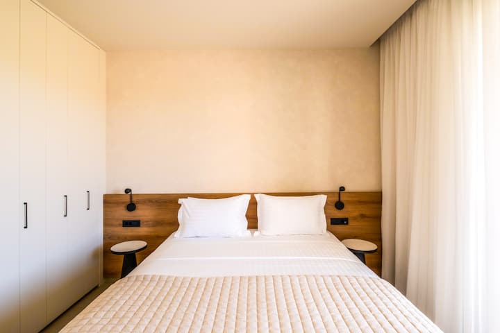 Villa 1 - Ground Floor - Bedroom 4 with queen bed, ensuite bathroom and garden access